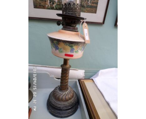 Paraffin lamp on circular brass and black pot base, hand painted peach shade