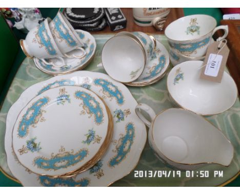 Complete 21 piece white ground Queen Anne bone china tea service with gilt and light blue garland decoration