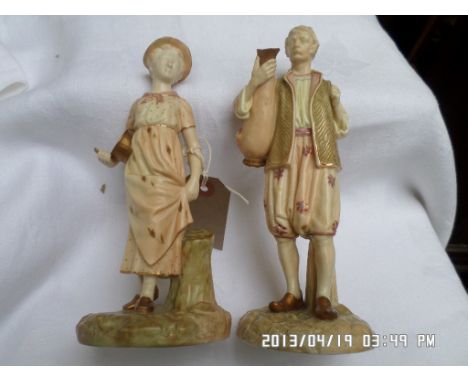 Pair of 19th century Royal Worcester figurines of male and female water carriers each approx. 21cm and 18cm high