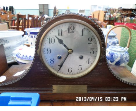 Early 20th century steel dialed mantel clock in oak shaped domed case