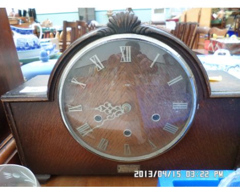Early 20th century oak domed cased mantel clock, the dial inset roman numerals