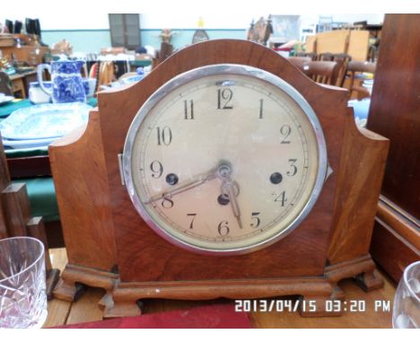 Steel dialed mantel clock in hooded oak case