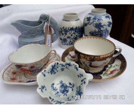 Collectors lot of blue and white and blue ground coffee canisters and a light blue cream jug with raised decoration of huntin