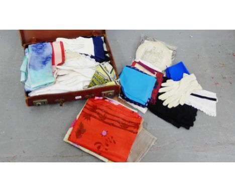 Brown leather case containing a selection of vintage scarves and gloves etc., (a lot) 