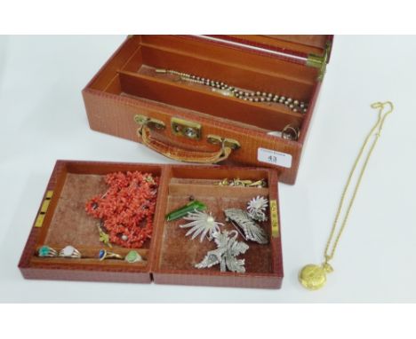 Brown leather jewellery box containing costume jewellery and vintage coral beads, etc 