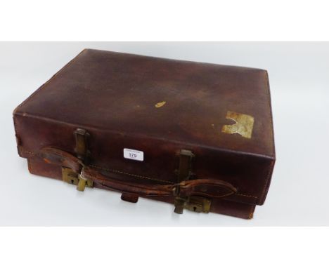 The Revelation, a vintage brown leather and brass mounted extending suitcase