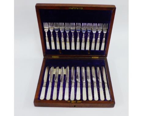 Twelve mother of pearl and Epns handled fruit knives and forks, in a mahogany canteen case 