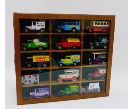 Showcase containing fifteen modern die cast Corgi trucks