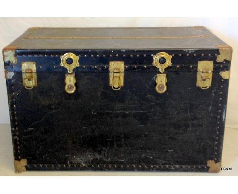 A large fitted brass bounded travelling trunk by Lexington Bloomingdales NY