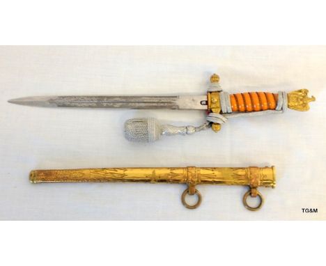 A German dagger in scabbard with makers mark to the blade Puma Solingen