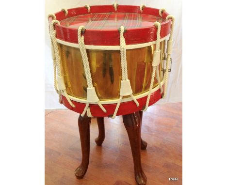 An unusual military side drum 16 inches diameter converted into a coffee table presentation piece with a plaque to Lieutenant