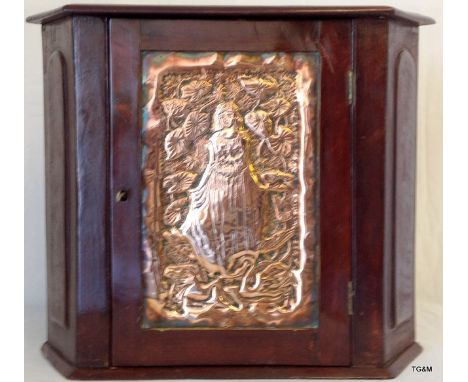 A mahogany corner hanging unit with an embossed Art Nouveau copper panel front depicting a woman 45h