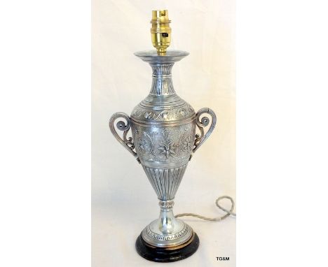 A silver plated lamp in the form of a twin handled vase