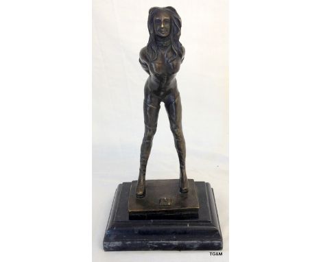 A bronze dominatrix figurine