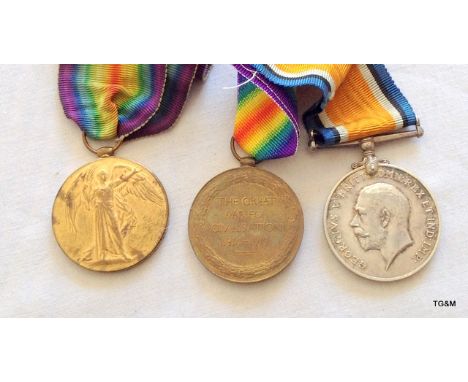 A WW1 medal pair to 43570 Private TM Aitchison of the Queens Regiment with a Victory medal to 013106 Acting Corporal EE Johns