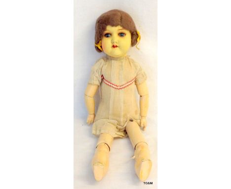 An 'Armand Marseille' German porcelain headed articulated doll model no 390 50cm long
