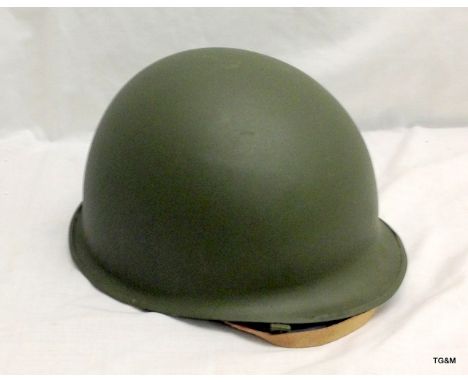 A reproduction MI US military helmet