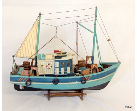 A scale wooden model of a sail fishing boat, 40cm x 46cm