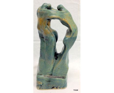 A pottery lovers knot signed by R Connell 32 cm tall