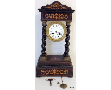 A 19th century inlay portico clock fitted a 2 train French movement with pendulum and key 45cm high striking on a bell