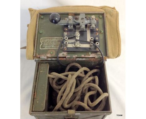 A WW2 British Military signal lamp and morse code box with instructions and spares box