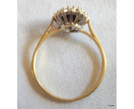A ladies 9ct gold daimond and sapphire ring. size R