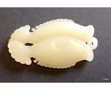 A carved Chinese White Jade twin fish pendant length 7.2cm