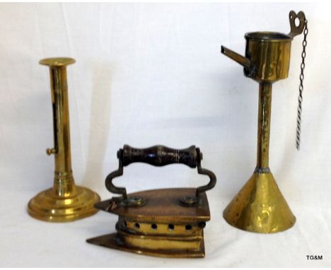 A Victorian brass melting pot ( 28cm), a candlestick and an iron