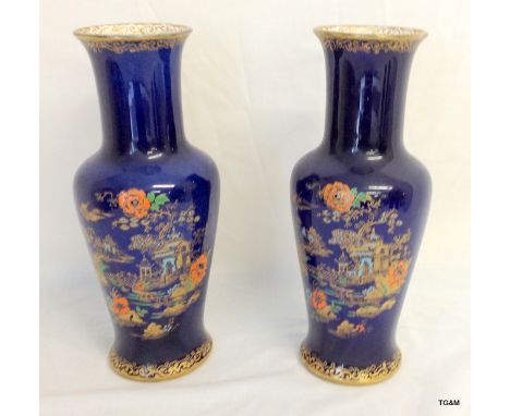 A pair of Pearline Pottery vases with enamel and gilt decoration depicting an Oriental scene. Impressed Ching mark to the bas
