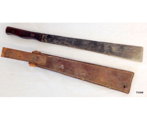 An unusual WW2 Machete in leather scabbard