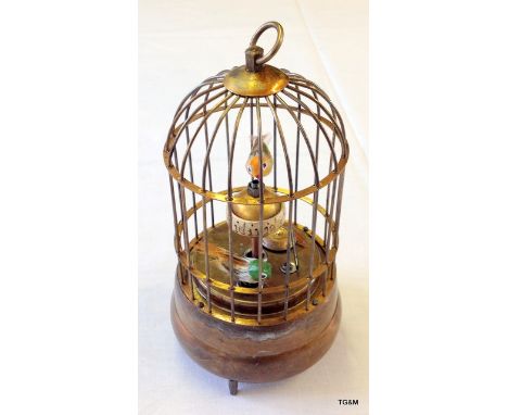 A Continental brass bird cage, with pierced base, scroll cast feet, 30cm H.