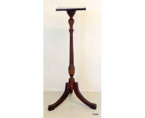A mahogany tripod plant/candle stand 94cm high