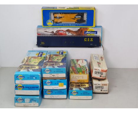 Four boxed Athearn HO scale American Box Cars, two boxed Dummy Locomotives, two other boxed Wagons, two boxed Rivarossi Ameri