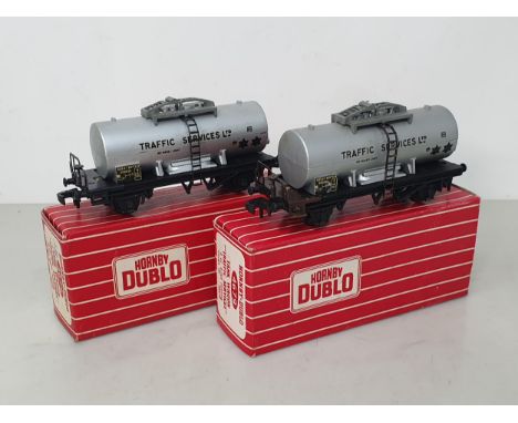 A rare Hornby Dublo 4679 un-plated walkway 'Traffic Services' Tank Wagon and a standard model for comparison, both boxed. The