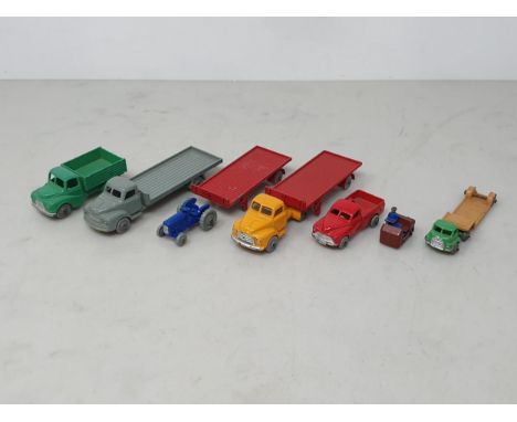 Six unboxed Dublo Dinky Toys including Bedford Articulated Flat Truck and spare Trailer, Bedford Flatbed Lorry, Austin Lorry,