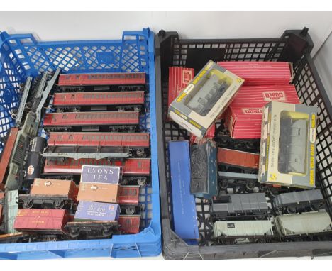 Two trays of Hornby Dublo and Wrenn Rolling Stock including seven unboxed B.R. Suburban Coaches, boxed 4323 S.R. Utility Van,