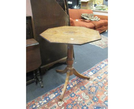 An octagonal tripod table, 71cm high  