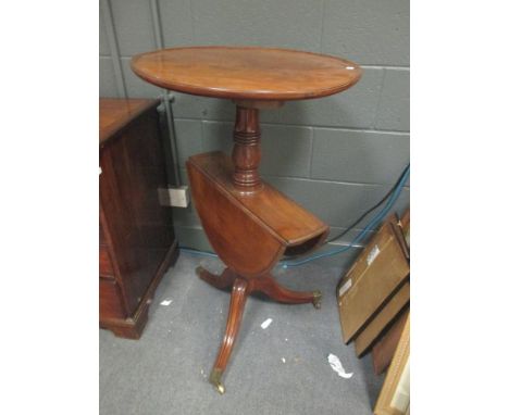 A 19th century mahogany two tier dumb waiter with folding leaves, on a tripod base, 96cm high  