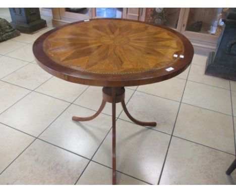 A circular specimen wood inlaid table on an associated tripod base, 74cm high, 81cm wide  