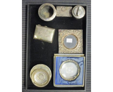 A matchbox or match holder, a cigarette case, a photograph frame (A/F), a table lighter and various coin set ashtrays  