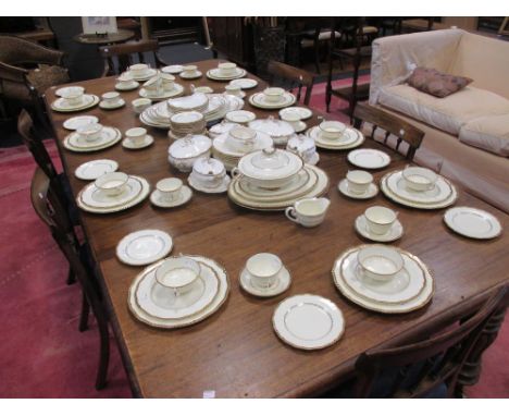 An extensive composite matched cream and gilt dinner and tea service, mainly Royal Doulton 'Belvedere'  