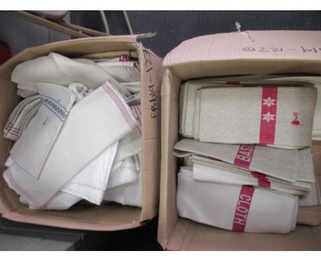 Two boxes of assorted household linen to include basin cloths, hand towels in cream, white and some with red and blue borders