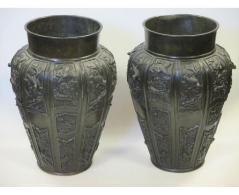 A pair of Japanese bronze Meiji period vases, 22cm high   