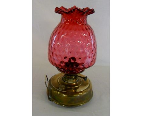 Late Victorian oil lamp with cranberry glass shade H 37 cm