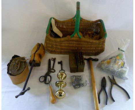 Wicker basket containing various tools, keys, shoe stretcher etc