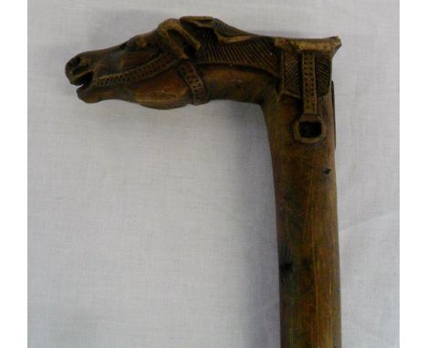 Walking stick with carved horse head handle