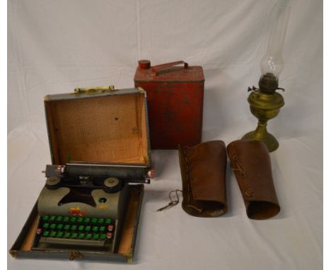 Red petrol can, brass paraffin lamp with glass chimney, typewriter & leather gaiters