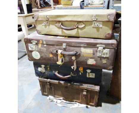 Three suitcases and a metal trunk