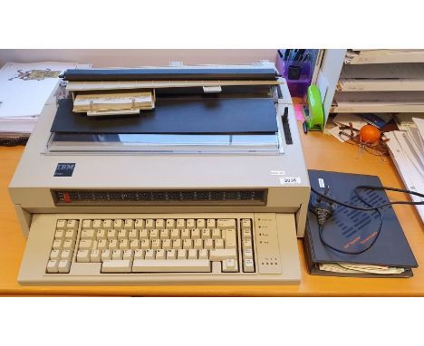 IBM 6747 electric typewriter with instruction manual and power lead
