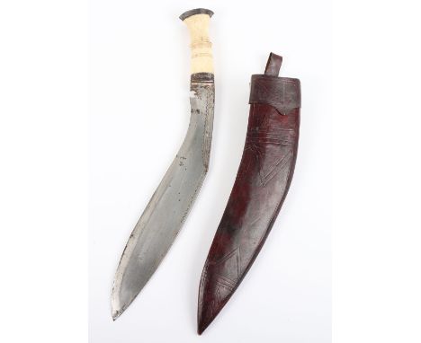 Large Indian Kukri, swollen blade with chiselled decoration to back edge, bone grip (small chip) brass covered horn pommel, i
